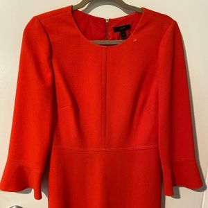 Beautiful tailored and feminine orange dress with slight bell sleeves